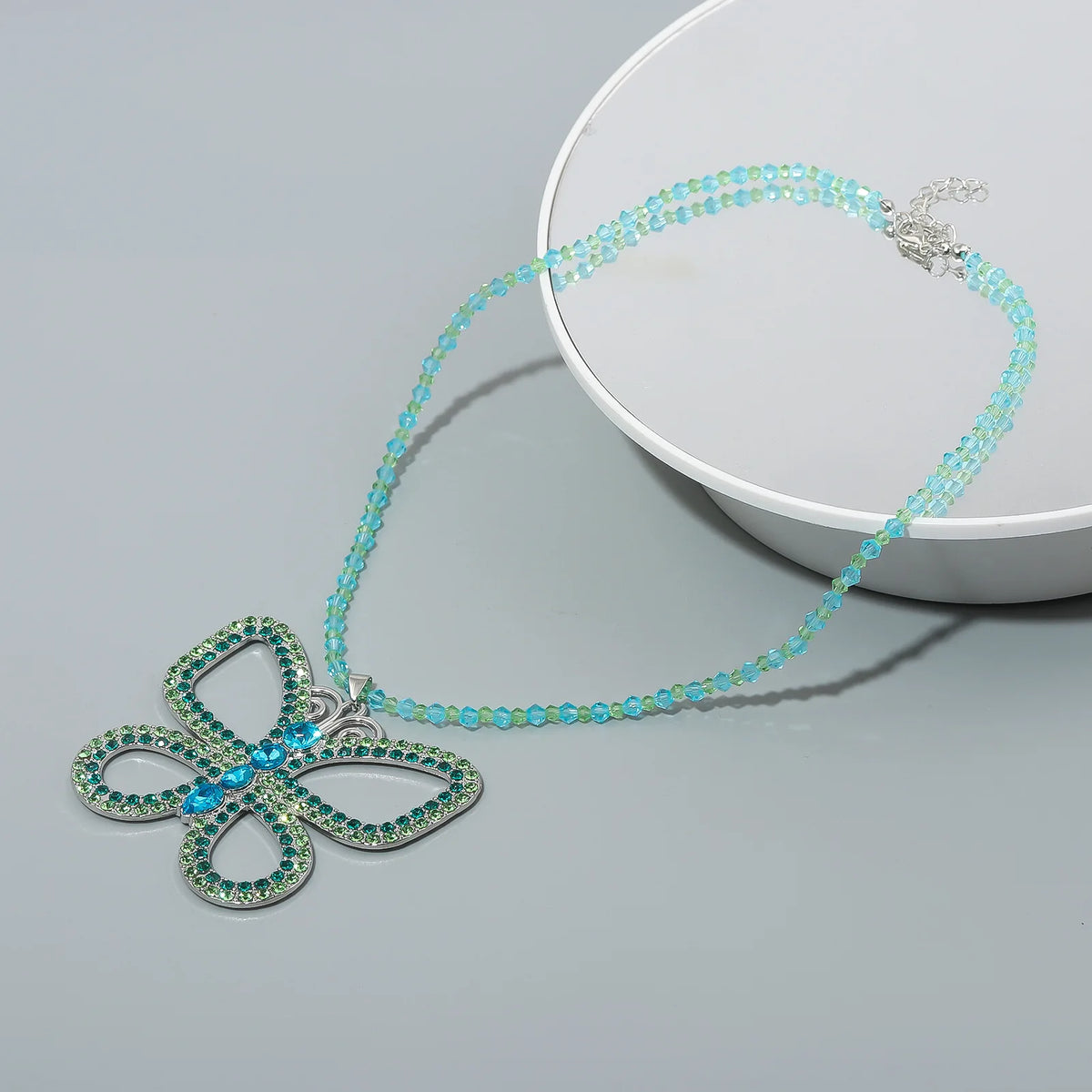 Ras-du-cou papillon strass doré