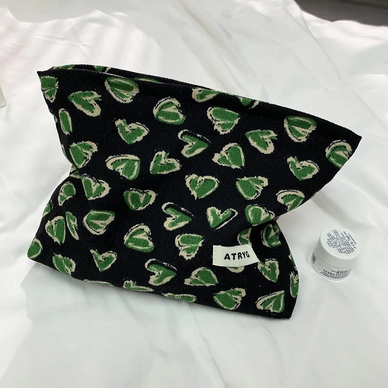 Trousse cosmétique aux motifs de feuilles exotiques pour l'automne
