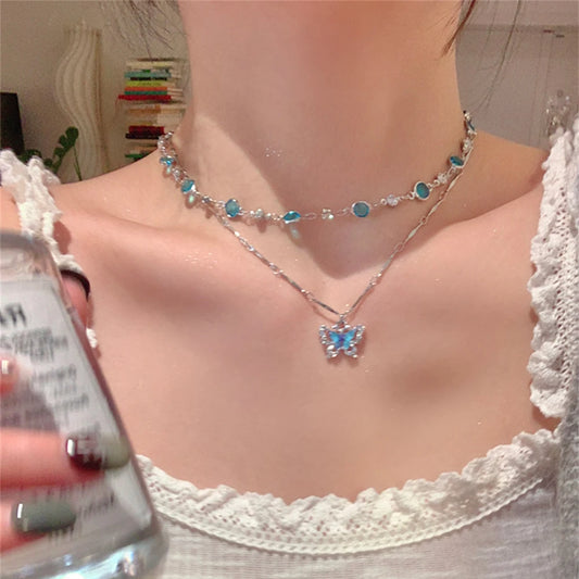 Collier papillon en cristal bleu